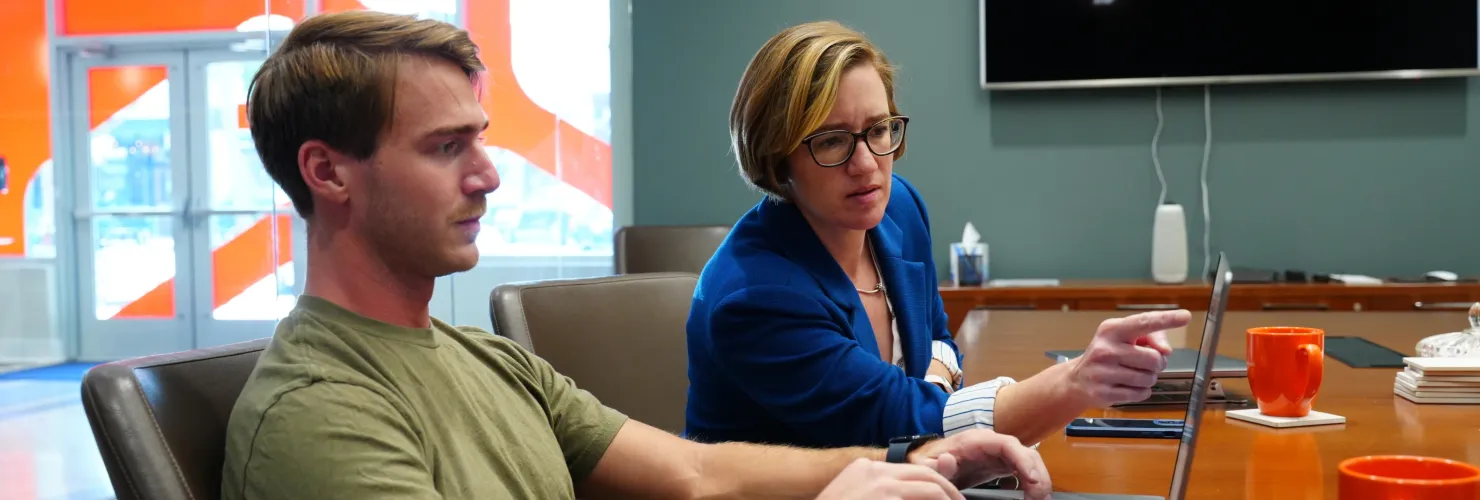 Cyberwoven team members collaborating during a meeting.